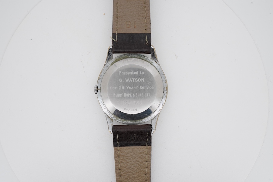 A gentleman's 1950's stainless steel Timor manual wind wrist watch, with Arabic and baton numerals dial and subsidiary seconds, on a later associated strap, case diameter 34mm, case back with engraved personal inscriptio